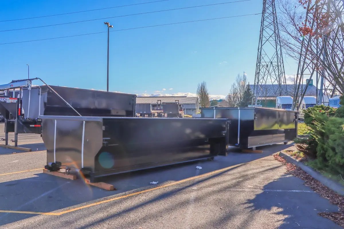Roll-off dumpster ready for waste disposal at job site for 4 Yard Dumpster Rental in Sumner